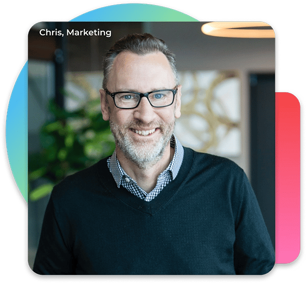 A man on the marketing team staring at the camera. He is wearing glasses