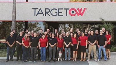 A photo of TCWGlobal workers when the company first launched in 2009 in front of the original building