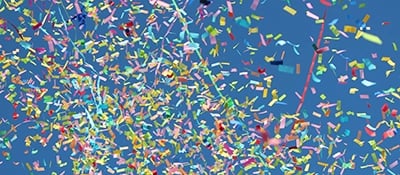 A picture of confetti representing TCWGlobal's accomplishment of payrolling its 100,000th worker